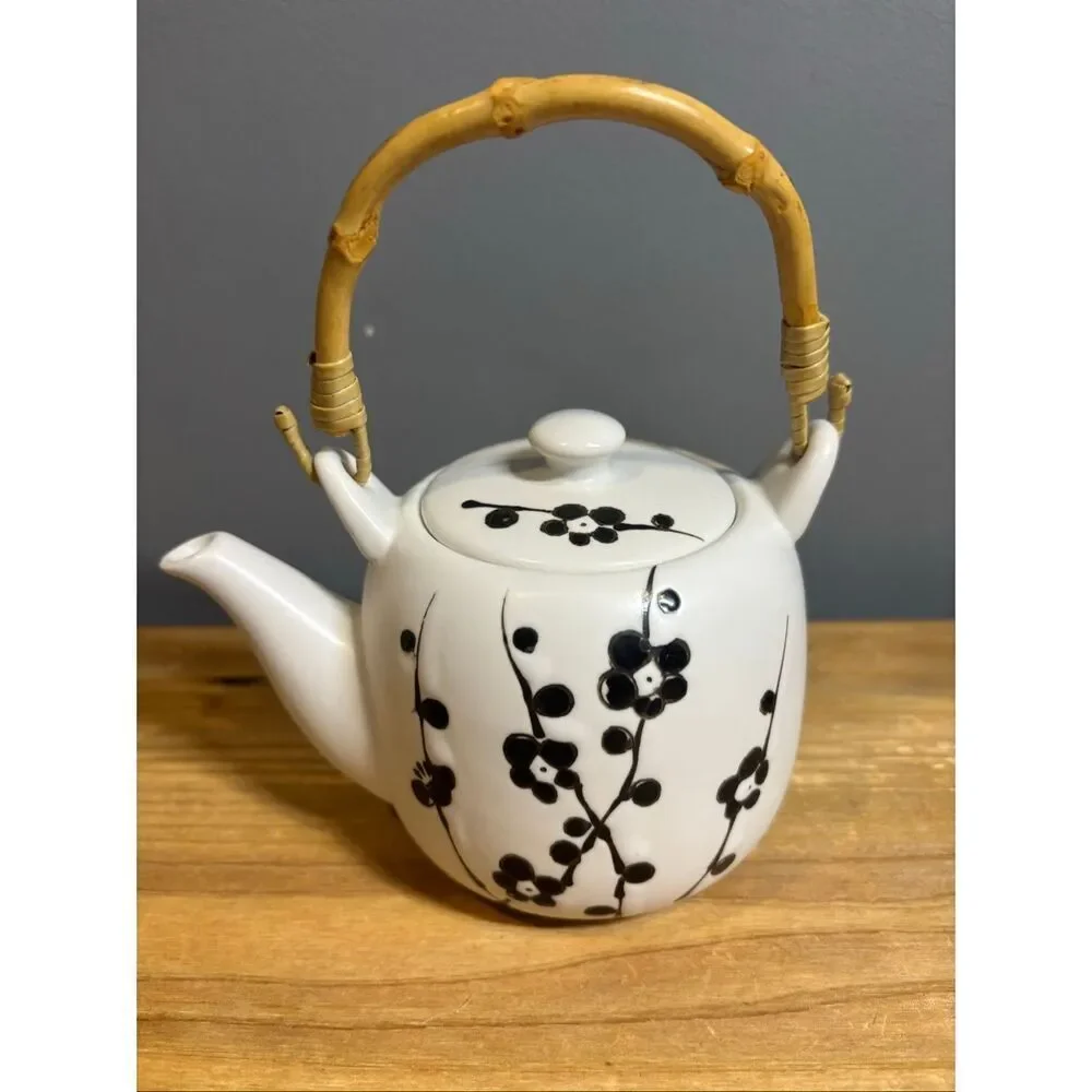 White ceramic tea pot and 4 tea cups with black cherry blossoms